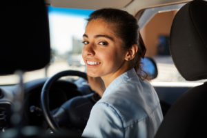 Young woman in her car