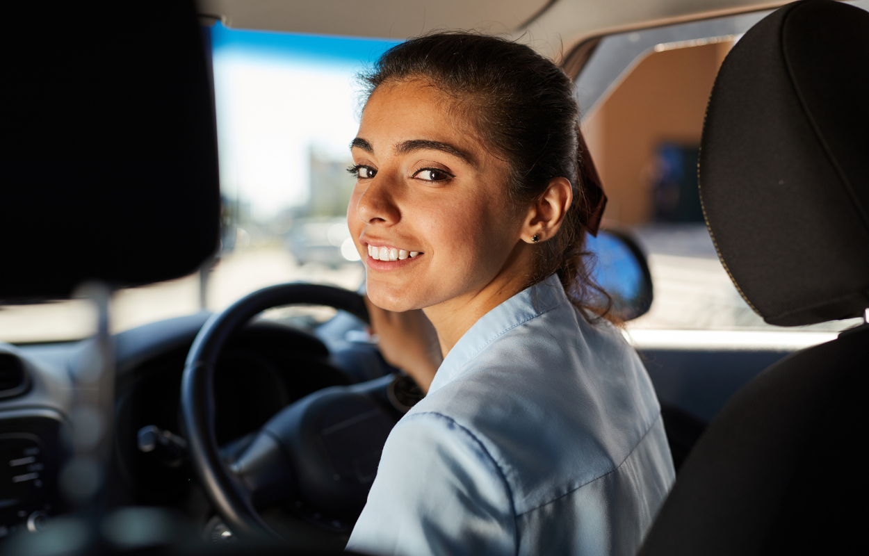 Young woman in her car